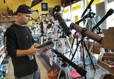 man in telescope shop man in telescope shop