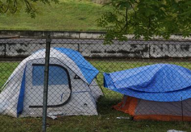 Tents behind a fence Tents behind a fence