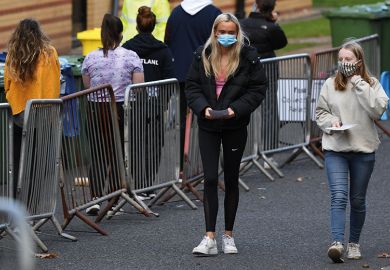 Students walk at a pop-up testing centre for Covid-19 in Glasgow, Scotland on September 24, 2020