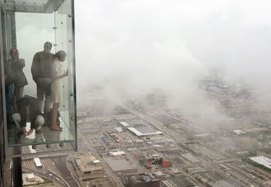 Visitors stand out on the Ledge, a glass cube that juts out from the 103rd floor Skydeck of the Sears Tower, Chicago Visitors stand out on the Ledge, a glass cube that juts out from the 103rd floor Skydeck of the Sears Tower, Chicago