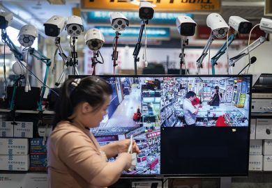 shopper surrounded by surveillance cameras