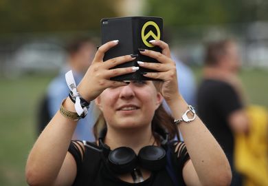 Woman filming with phone