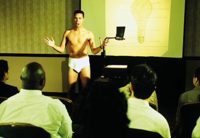 A man lecturing in his underwear