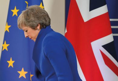 Britain's Prime Minister Theresa May leaves after a press conference following a special meeting of the European Council to endorse the draft Brexit withdrawal agreement 