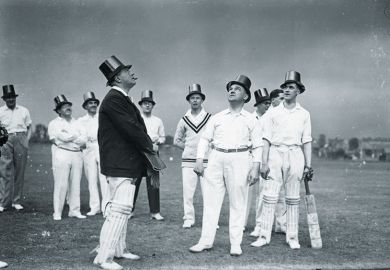 Cricket players wearing top hats