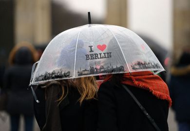 Women under “I love Berlin” umbrella