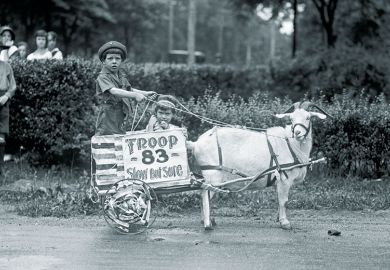 Goat pulls young boys’ cart in the Tacoma festival Goat pulls young boys’ cart in the Tacoma festival