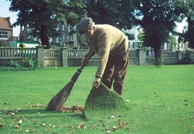 man sweeping under