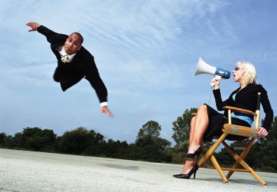 Businesswoman with megaphone shouting at man flying, outdoors