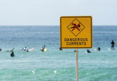 Dangerous currents warning sign on beach, Australia