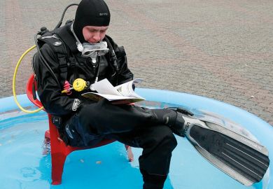 Scuba diver in a paddling pool
