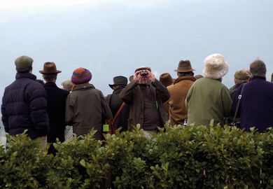 Man looking the other way at horse race