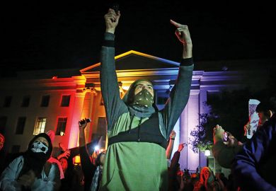 People protest on February 1, 2017 in Berkeley, California. A speech by controversial Breitbart writer Milo Yiannopoulos, who was scheduled to speak at UC Berkeley, was cancelled after protesters and police engaged in violent skirmishes
