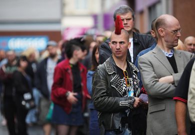 Punk standing in a queue