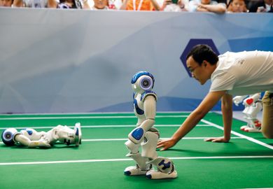 Robots run in a robot relay race as part of the 2017 World Robot Conference in Beijing, China.