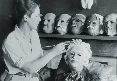 Woman making a mask of Albert Einstein