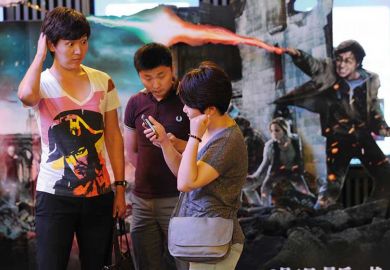 Chinese people in front of a Harry Potter backdrop