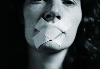 Woman with tape over her mouth Woman with tape over her mouth