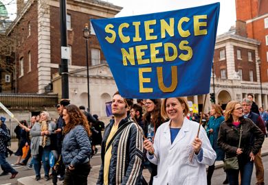 A protester holds a "Science needs EU" banner on a march and rally organised by the pro-European People's Vote campaign for a second EU referendum in Parliament Square, central London on March 23, 2019 A protester holds a "Science needs EU" banner on a march and rally organised by the pro-European People's Vote campaign for a second EU referendum in Parliament Square, central London on March 23, 2019