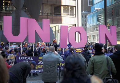 Members of the Service Employees International Union hold a rally in support of the American Federation of State County and Municipal Employees union