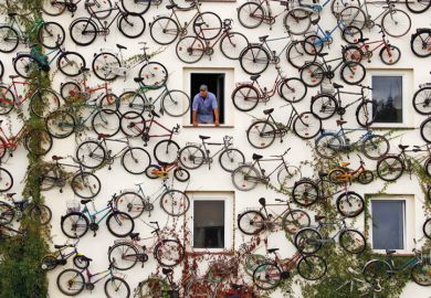 Christian Petersen looks out of shop window, Altlandsberg, Berlin, 2010