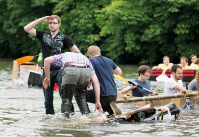 Cambridge University Students Cardboard Boat Race. A good captain never abandons his boat even as she goes down Cambridge University Students Cardboard Boat Race. A good captain never abandons his boat even as she goes down