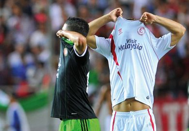 football players swapping shirt