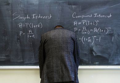 A teacher turned to face the blackboard