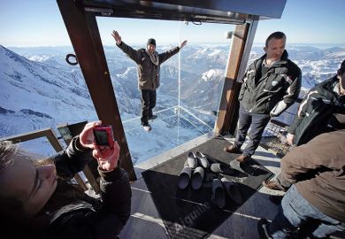 People at the 'Step into the Void' installation in the French Alps, France