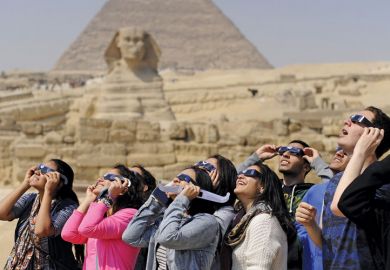 People viewing solar eclipse, Pyramids of Giza, Sphinx, Egypt People viewing solar eclipse, Pyramids of Giza, Sphinx, Egypt