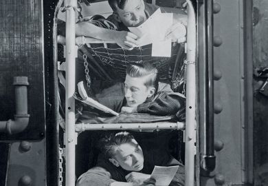 Sailors in bunk beds in submarine