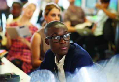 Male university student listening to seminar