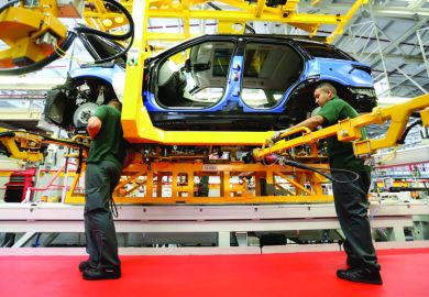 Production line employees working on Range Rover Production line employees working on Range Rover