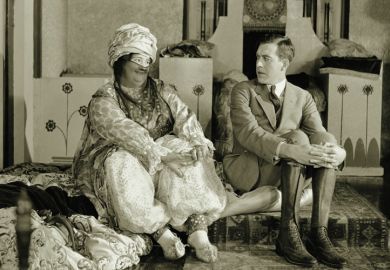 Man looking uncomfortable as woman looks at him