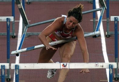 Hurdler runs into hurdle