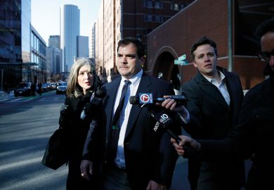 Stanford University sailing coach John Vandemoer, centre, is questioned by reporters as he leaves the John Joseph Moakley United States Courthouse in Boston on March 12, 2019.  Stanford University sailing coach John Vandemoer, centre, is questioned by reporters as he leaves the John Joseph Moakley United States Courthouse in Boston on March 12, 2019.