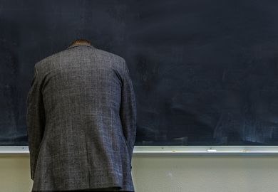 teacher frustrated at blackboard
