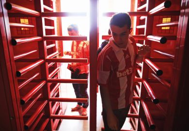 Supporters enter the ground through the turnstiles prior to the Barclays Premier League match between Stoke City and Norwich City at the Britannia Stadium in Stoke on Trent, England Supporters enter the ground through the turnstiles prior to the Barclays Premier League match between Stoke City and Norwich City at the Britannia Stadium in Stoke on Trent, England
