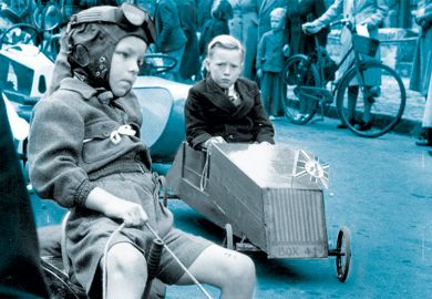 Young competitors make their way to the starting point on an assortment of vehicles.