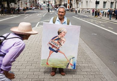 A woman looks at a painting by political artist Kaya Mar on Whitehall ahead of the pro-EU 'March for a People's Vote' in London A woman looks at a painting by political artist Kaya Mar on Whitehall ahead of the pro-EU 'March for a People's Vote' in London