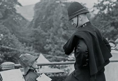 Policeman and boy wearing police costume