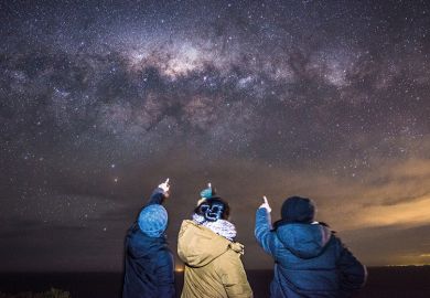 3 people looking at the Milky Way