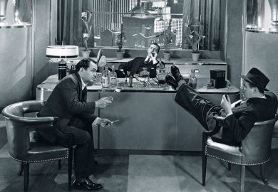 men in office with feet on desk. Vintage