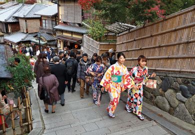 People walking up steps in Kyoto, Japan