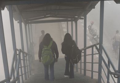 Image of students walking down stairs in the fog