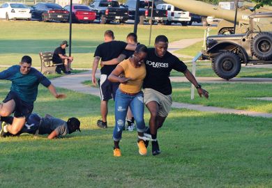People running a three-legged race