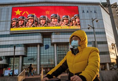 Man wearing a facemask in Beijing, China Man wearing a facemask in Beijing, China