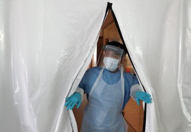 A laboratory technician wearing full PPE (personal protective equipment) works at a new Lighthouse Lab facility dedicated to testing for the novel coronavirus COVID-19, at Queen Elizabeth University Hospital in Glasgow on April 22, 2020.