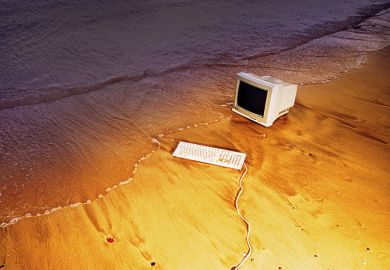 Old computer on beach