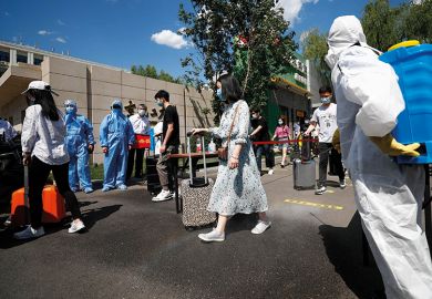 Teachers wearing face masks take part in a drill at Beijing University of Chemical Technology on May 27, 2020 in Beijing, China. The university carried out an epidemic prevention and control drill on Wednesday in preparation for its reopening.  Teachers wearing face masks take part in a drill at Beijing University of Chemical Technology on May 27, 2020 in Beijing, China. The university carried out an epidemic prevention and control drill on Wednesday in preparation for its reopening.